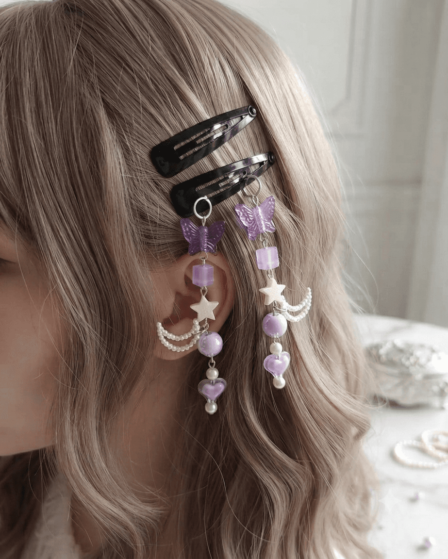 Woman wearing matching purple butterfly hair clips with lavender beads, white stars, crescent details and heart accents