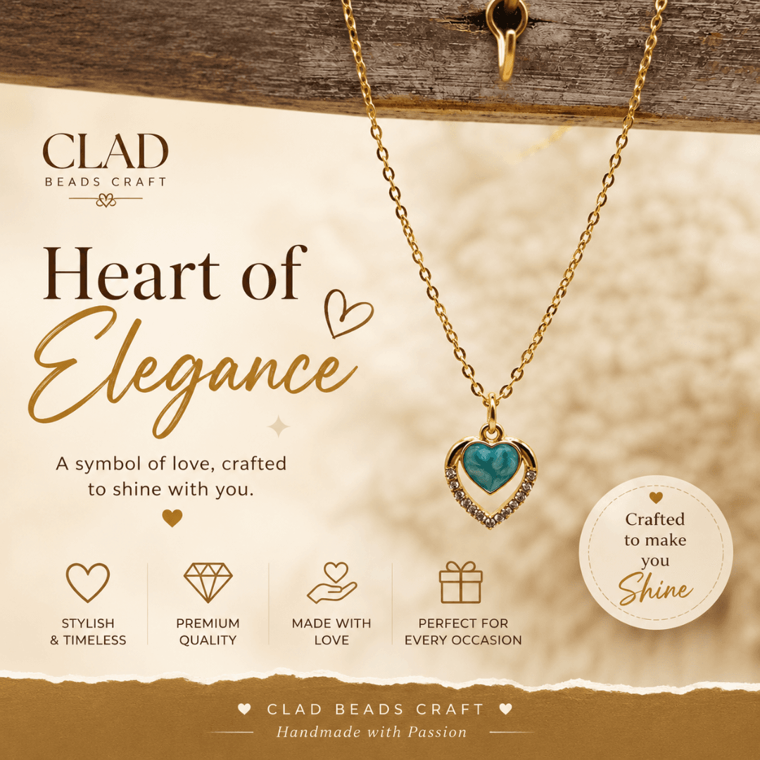 Gold-tone blue heart pendant necklace presented with Clad Beads Craft handmade jewellery branding.