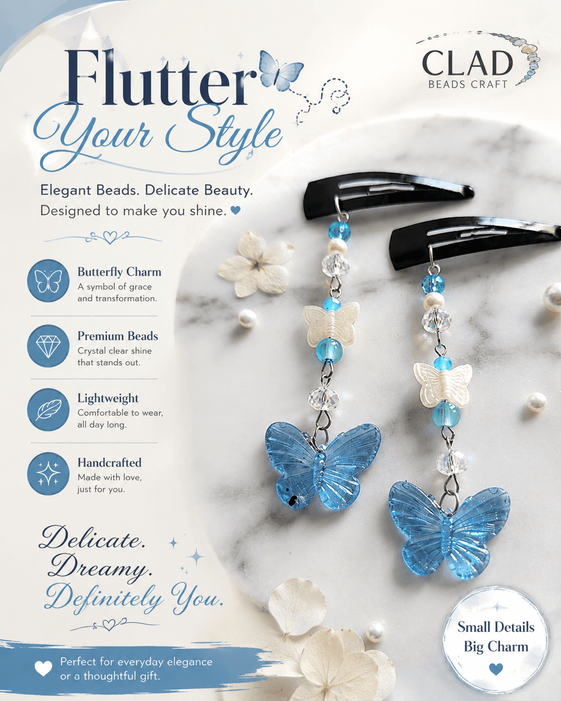 Pair of handmade blue butterfly dangle hair clips with white butterfly details, blue beads and clear faceted beads displayed on a marble-style surface.