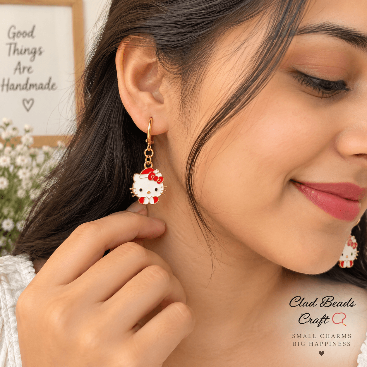 Hello Kitty-inspired red and white character charm hoop earrings worn with a casual outfit Hello Kitty-inspired red and white character charm hoop earrings worn with a casual outfit