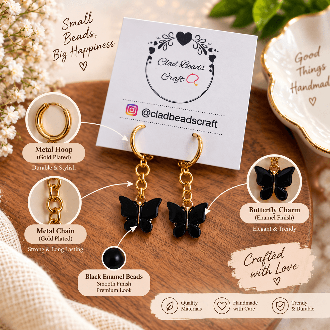 Black butterfly drop hoop earrings with gold-plated metal hoops, gold-plated chain and glossy black enamel-finish butterfly charms.