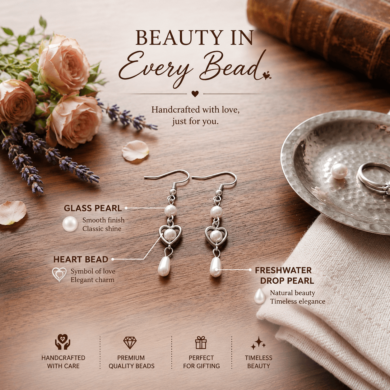 White pearl-look heart drop earrings with silver-tone metal details and dangling white beads